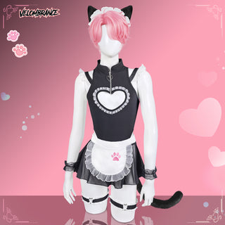 A pink-haired anime-style female cosplay model wearing a black and white maid outfit with cat ears, a headpiece, wrist cuffs, thigh straps, and a black tail, posed against a pink heart-patterned background.